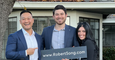 Happy clients from Danville standing in front of their new home.